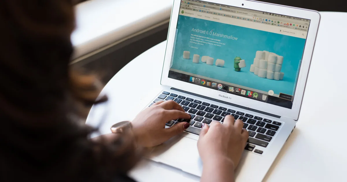 A Singapore small business owner comparing their Instagram page and website on a laptop and phone