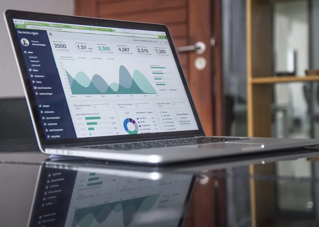 Laptop showing advertising analytics dashboard for comparing Google Ads and Meta Ads performance