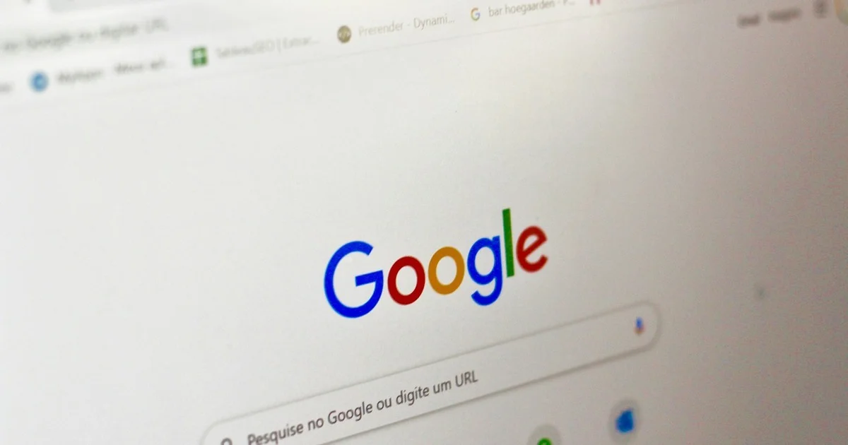 Close-up of a Google search homepage on a computer screen, illustrating the moment a buyer types a query that surfaces an AI Overview response